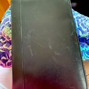 COACH genuine leather zippered planner.